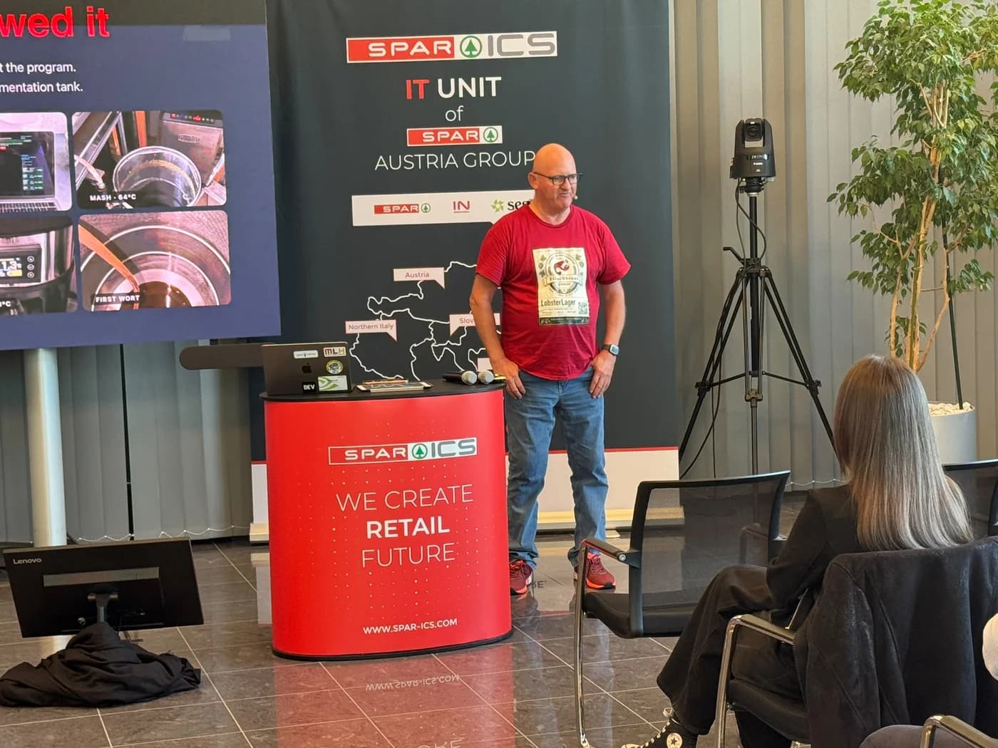 Gerhard presenting the Lobster Lager story beside the SPAR ICS banner in Salzburg