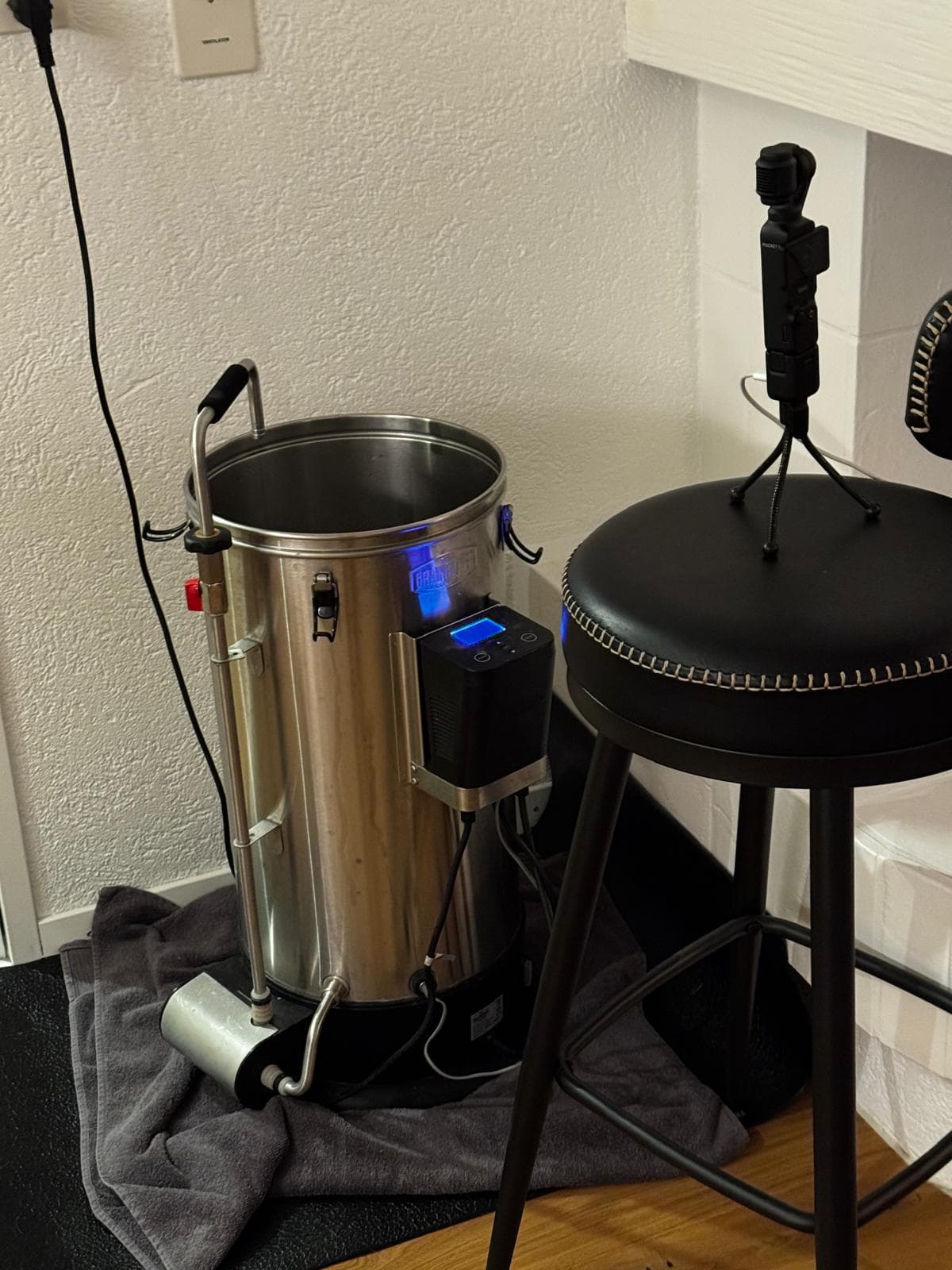 Camera on tripod next to Grainfather G30 for visual monitoring