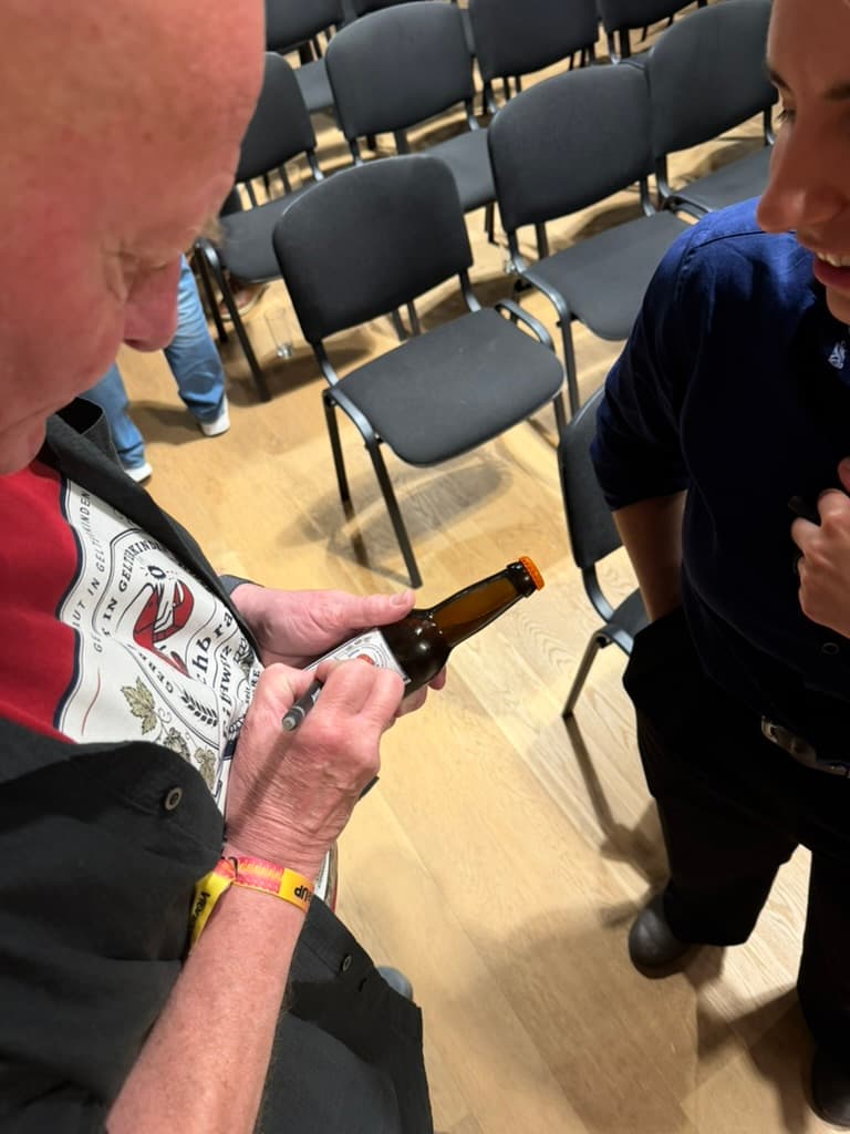 Gerhard signing a bottle of Lobster Lager